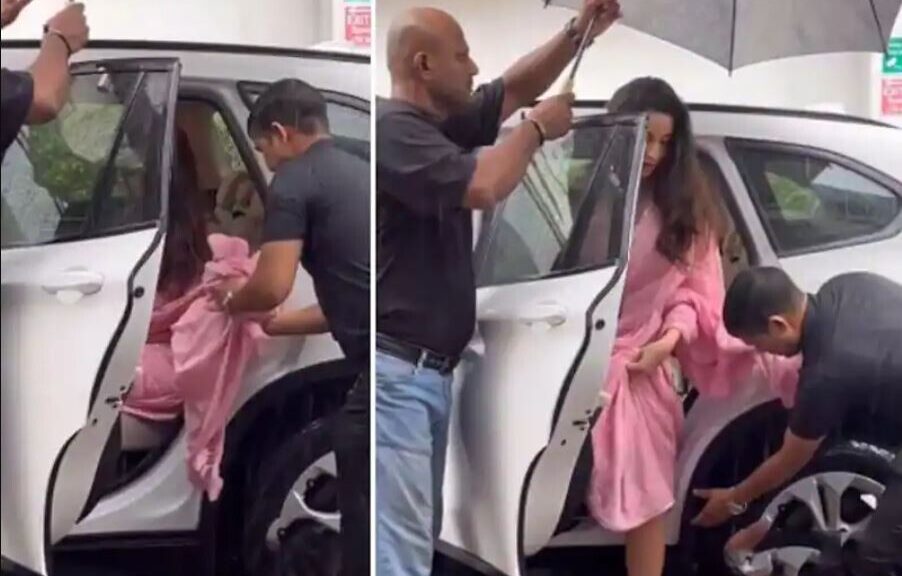 See video! Trolls slam Nora Fatehi for making security hold her saree in heavy rain